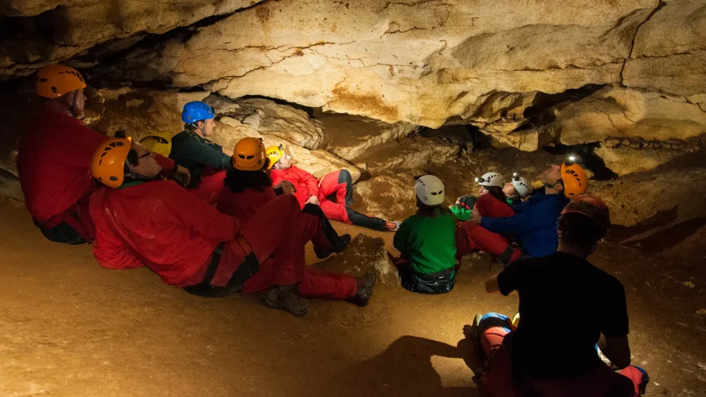 Group in the Saint-Marcel cave, for an underground hike